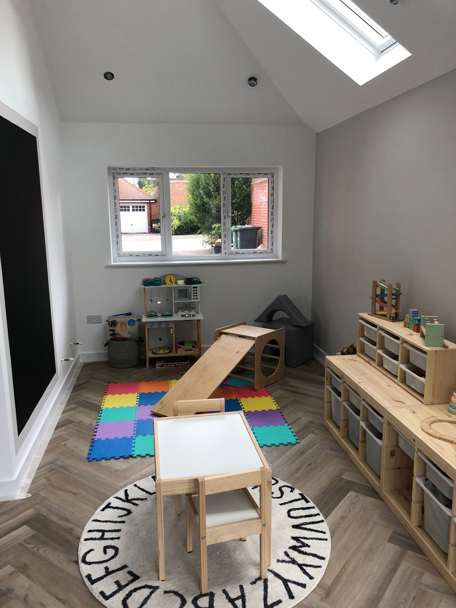 After — completed garage conversion playroom with Velux skylight